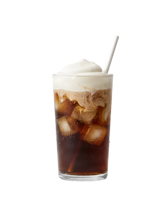 A glass of cola over ice with cream on top